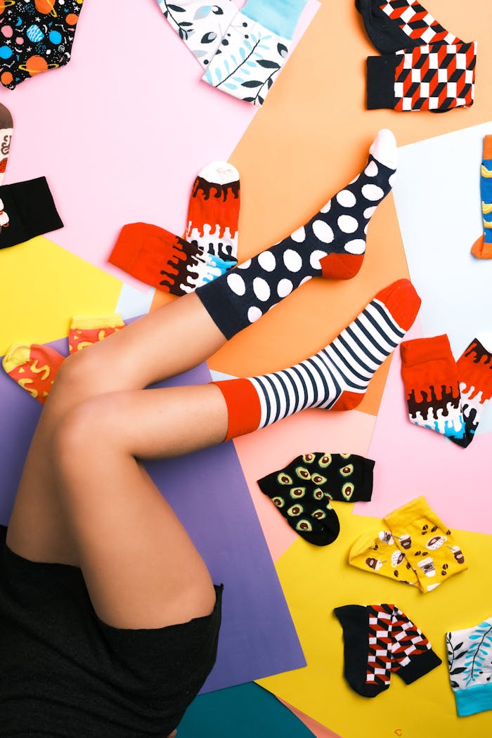 Vibrant patterned socks on legs showcasing various colorful designs in İstanbul.
